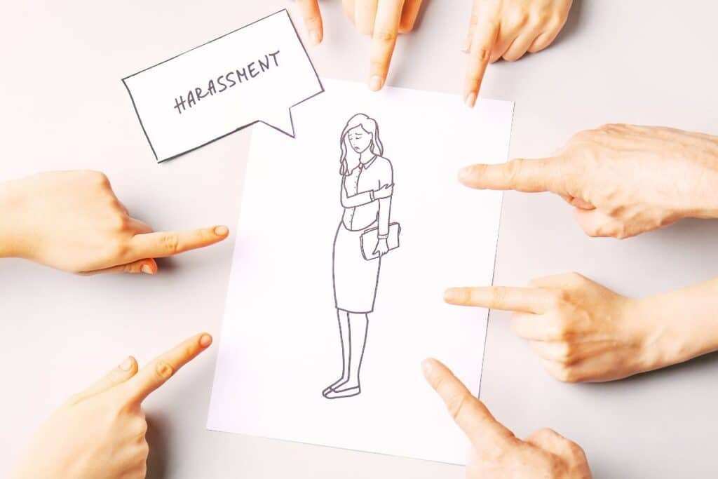 male fingers pointing at a line drawing of a female